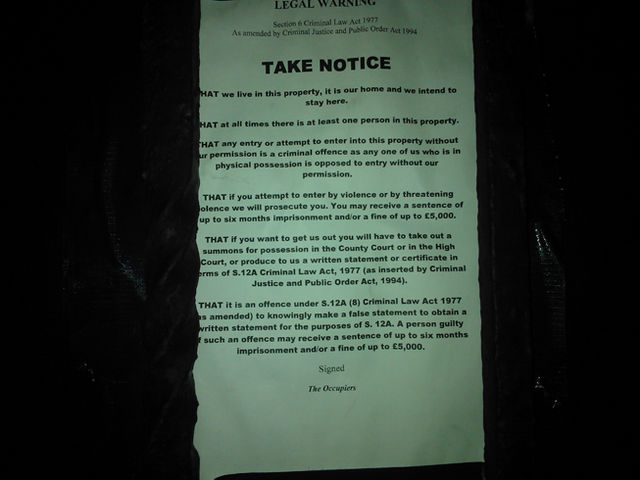 Section 6 notice posted on the front of the squat